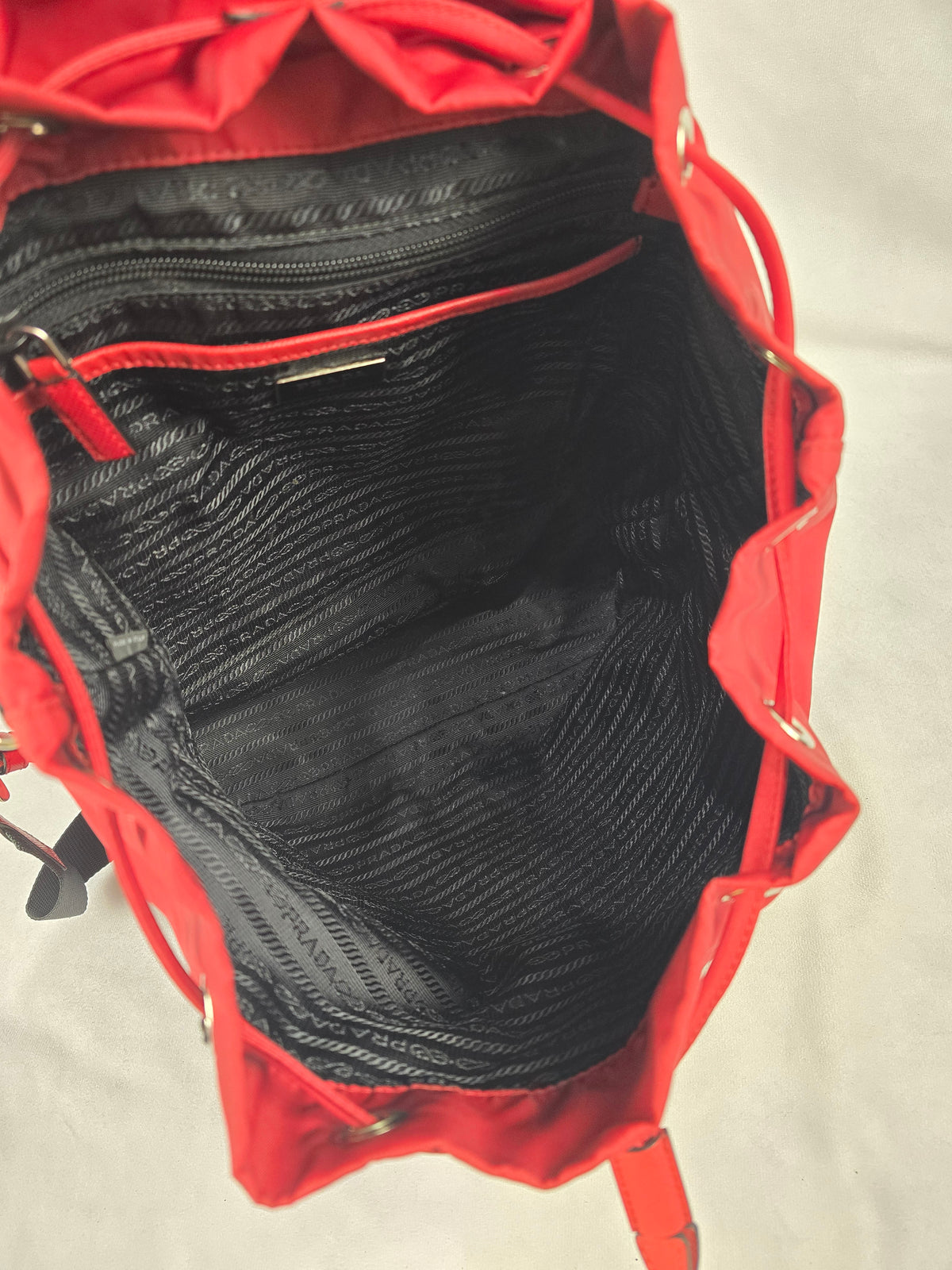 Prada Tessuto Nylon Drawstring Buckle Backpack in Red