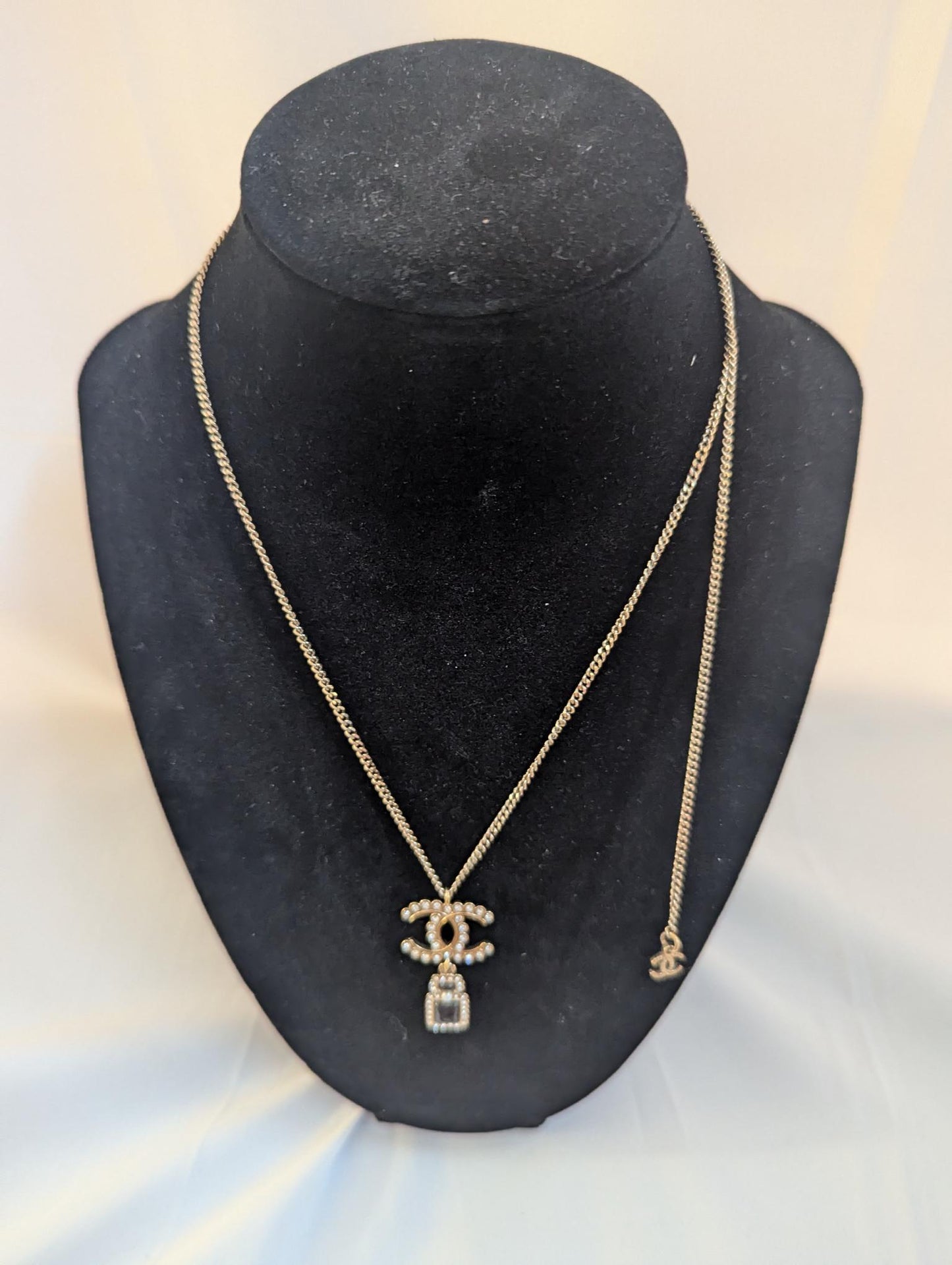 Chanel CC With Small Black Perfume with Pearl Necklace