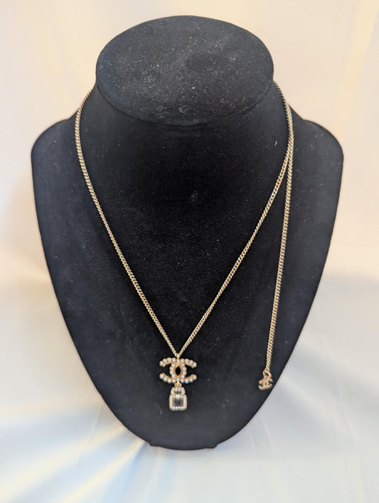 Chanel CC With Small Black Perfume with Pearl Necklace