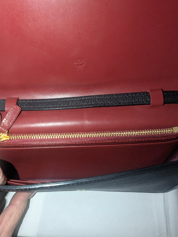 MCM Small Black with Red and Gold Bow Accent Clutch with Crossbody Strap