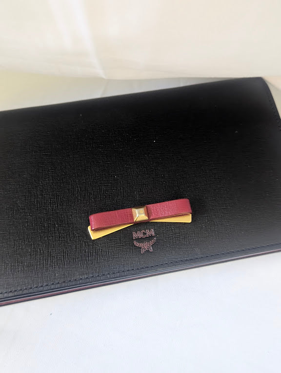 MCM Small Black with Red and Gold Bow Accent Clutch with Crossbody Strap