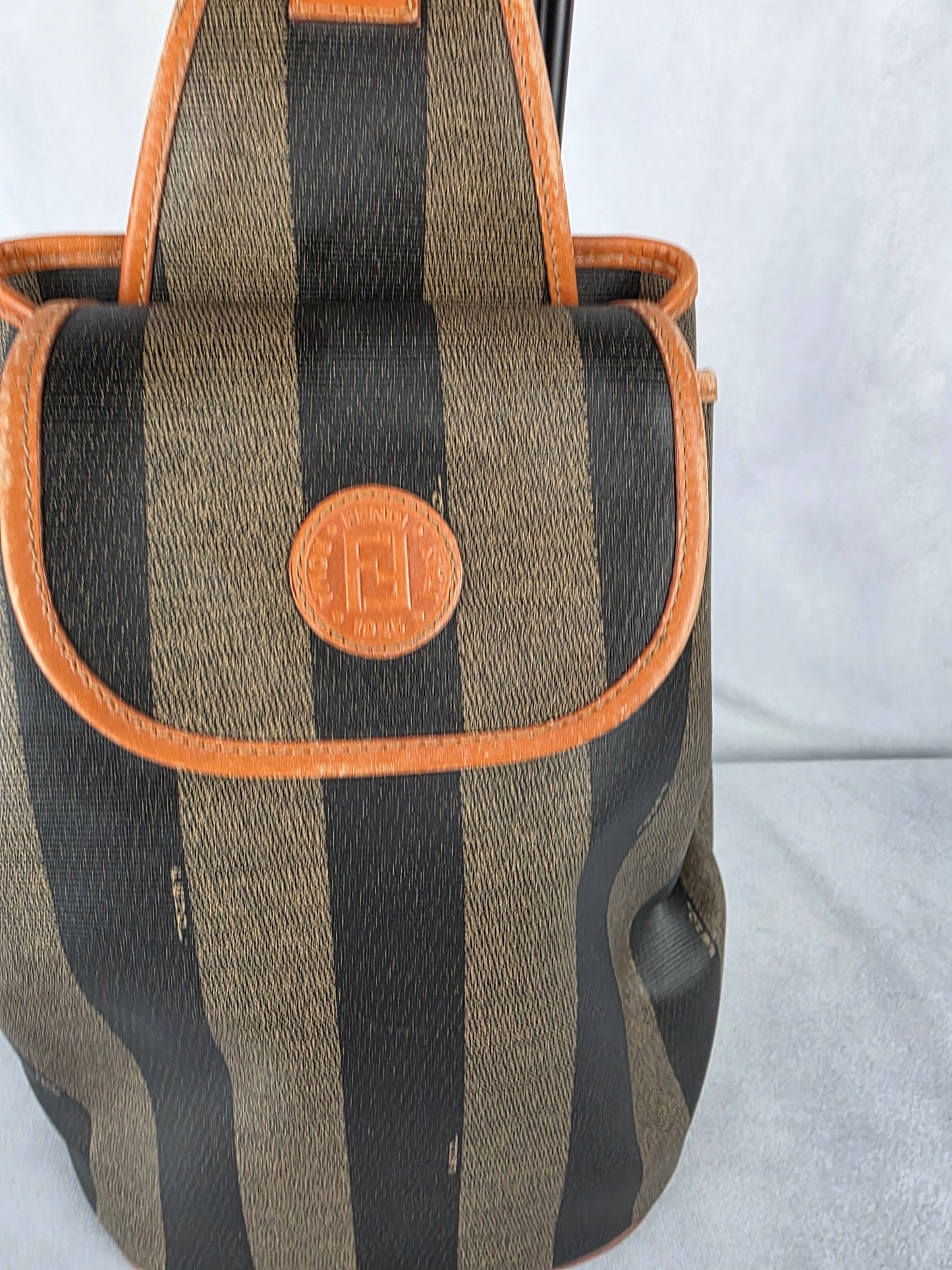 FENDI PEQUIN STRIPED SLING BACKPACK