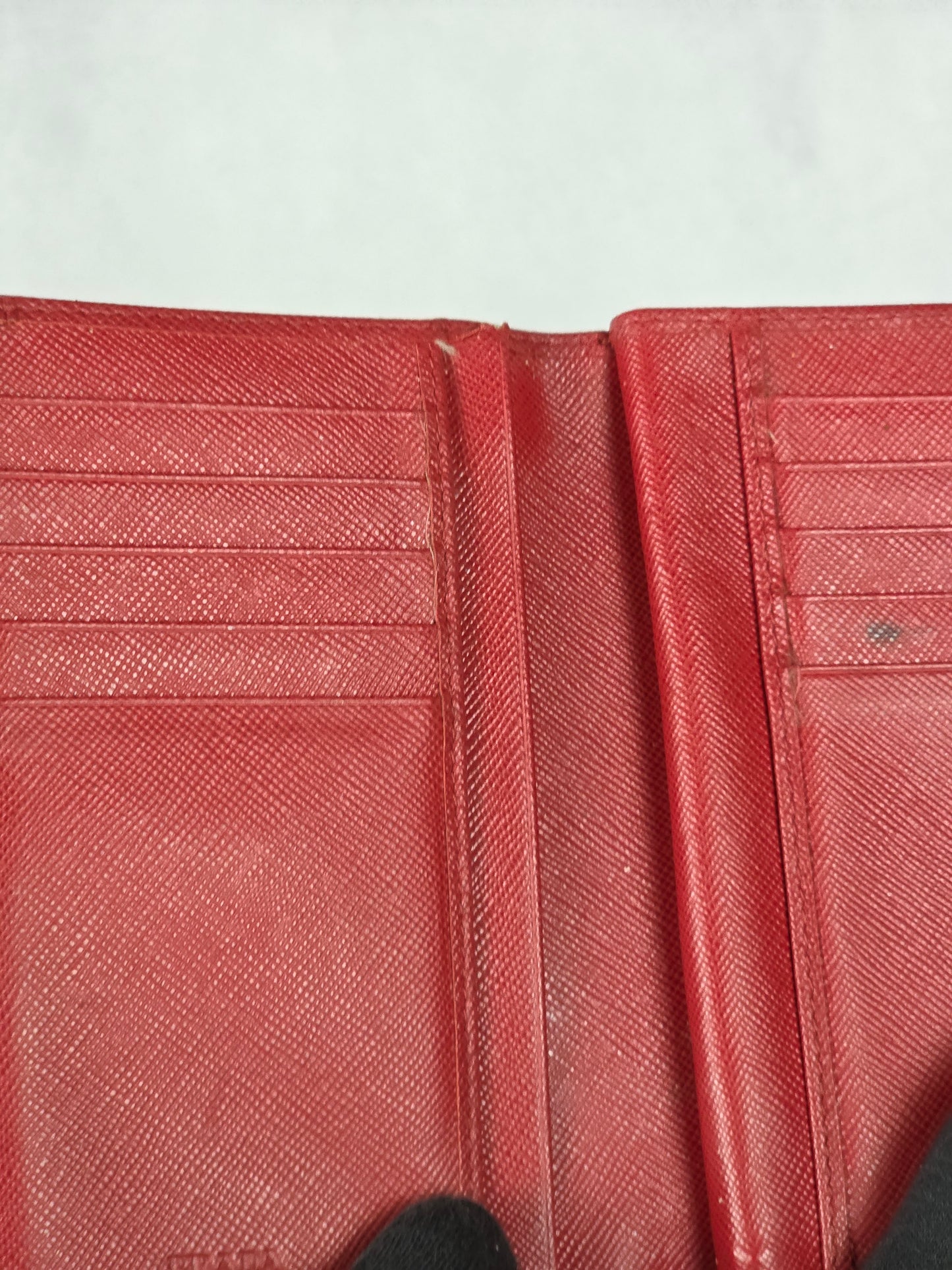 PRADA SAFFIANO RED TRIANGLE MOTIF ZIP/BIFOLD WALLET